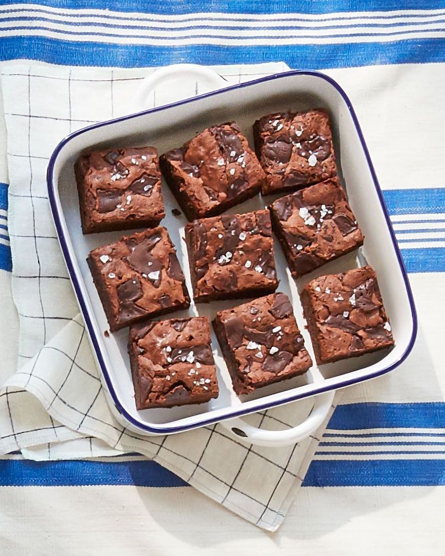 fudgy stout brownies cut into squares in a white square baking dish